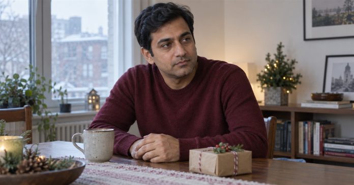 Thinking About a Holiday Breakup? Five Checks for Pressure, Clarity and Safety Man quietly reflecting at home with a small holiday gift nearby.
