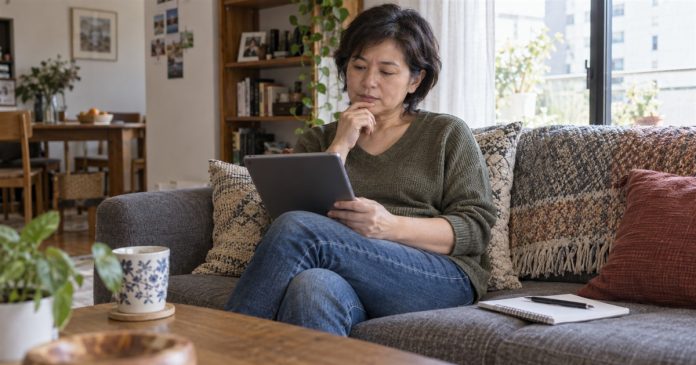 Assessing a Psychic Reader: Eight Checks for Claims, Costs and Conduct Woman thoughtfully reviewing a service offer on a tablet at home.